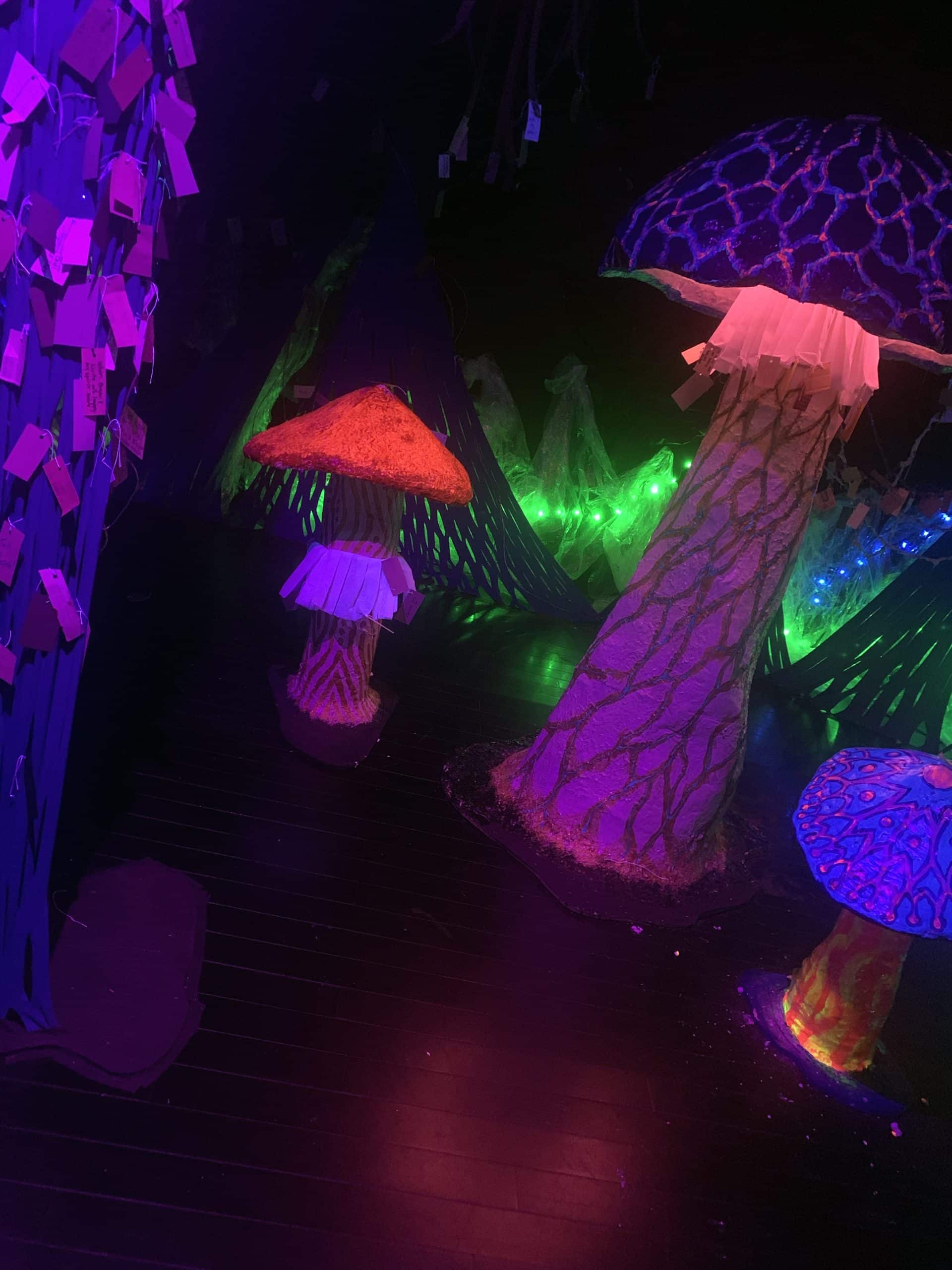 giant paper mache mushrooms of bright neon colors